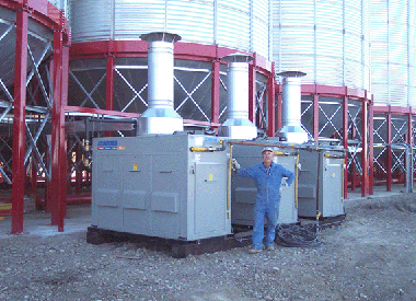Bridgview Farms - grain management system with three of six 2000-1200 central heating modules (total of 6 million BTU/H output) set up to dry at twenty-four 20,000 bushel bins. 